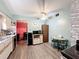 Bright kitchen with wood laminate flooring, white ceiling fan, and stainless steel sink at 200 Dr Martin Luther King Jr Se St, Fort Meade, FL 33841