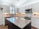 Well-lit kitchen features custom cabinets and stainless steel appliances at 2161 Park Forest Blvd, Mount Dora, FL 32757