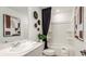 Stylish bathroom with a modern sink, sleek faucet and a convenient shower-tub combination at 2500 Penguin Blvd, Davenport, FL 33837