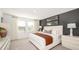 Inviting bedroom featuring a neutral palette, a large bed, and plenty of natural light from the windows at 2500 Penguin Blvd, Davenport, FL 33837