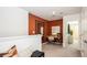 Upstairs hallway featuring a small home office with a mirror, desk, chair, and warm paint color at 2500 Penguin Blvd, Davenport, FL 33837