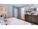Comfortable main bedroom with neutral tones, a spacious closet, and an ensuite bathroom for added convenience at 2504 Penguin Blvd, Davenport, FL 33837