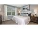 Comfortable bedroom features a large window and plush bedding for a relaxing retreat at 2512 Penguin Blvd, Davenport, FL 33837