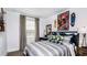 Stylized bedroom with skateboard decor and a comfortable bed, great for a young person at 2512 Penguin Blvd, Davenport, FL 33837