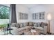 Comfortable living room features a sofa, stylish coffee table, and large windows for natural light at 2512 Penguin Blvd, Davenport, FL 33837