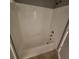 A clean and well-lit bathroom features a shower-tub combo and neutral-toned tile at 2516 Grassy Point Dr # 206, Lake Mary, FL 32746