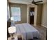 Bright bedroom with ceiling fan, a window with blinds, and closet at 2516 Grassy Point Dr # 206, Lake Mary, FL 32746