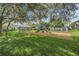 Community playground with play structure and gazebo offers a perfect space for outdoor fun and relaxation at 2516 Grassy Point Dr # 206, Lake Mary, FL 32746