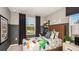 Stylish bedroom with bright decor, playful accents, and a comfortable bed at 2520 Penguin Blvd, Davenport, FL 33837