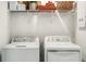 Functional laundry room with a white washer and dryer set at 2520 Penguin Blvd, Davenport, FL 33837