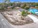 A high aerial view of a cozy home featuring a modern driveway surrounded by a wide dirt lot at 281 Luis Ln, Debary, FL 32713