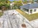 Aerial view of the house showing gravel backyard and small trees at 281 Luis Ln, Debary, FL 32713