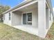 Backyard patio with sliding glass door access; view of the yard at 281 Luis Ln, Debary, FL 32713