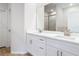 Bathroom with double sinks, quartz countertops, and modern fixtures at 281 Luis Ln, Debary, FL 32713