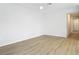 Spacious bedroom with wood-look flooring, a ceiling fan, and ample natural light at 281 Luis Ln, Debary, FL 32713