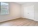 Bedroom with window, closet and wood-look flooring at 281 Luis Ln, Debary, FL 32713