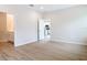 Neutral bedroom with luxury vinyl planking, with ensuite bath and kitchen views at 281 Luis Ln, Debary, FL 32713