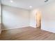 Spacious bedroom featuring wood floors and a view into the ensuite bathroom at 281 Luis Ln, Debary, FL 32713