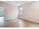 Large bedroom featuring luxury vinyl planking and a big window at 281 Luis Ln, Debary, FL 32713