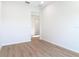 Bedroom with wood-look floors and bright, neutral paint at 281 Luis Ln, Debary, FL 32713