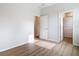 Bedroom features wood-look floors and view of bathroom at 281 Luis Ln, Debary, FL 32713