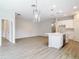 Open floor plan showcases a spacious living area connected to a modern kitchen at 281 Luis Ln, Debary, FL 32713
