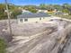 New construction home with a gray roof and a light beige stucco exterior in a rural neighborhood at 281 Luis Ln, Debary, FL 32713