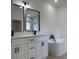Modern bathroom featuring double vanity, black fixtures, and a sleek standalone soaking tub at 2942 Sw 162Nd St, Ocala, FL 34473