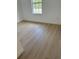 Bright bedroom with luxury vinyl plank flooring and a window with a view at 2942 Sw 162Nd St, Ocala, FL 34473