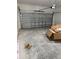 Spacious garage with a closed metal door and concrete flooring, ready for storage at 2942 Sw 162Nd St, Ocala, FL 34473