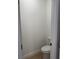 Small powder room with neutral paint, tile floors and white toilet at 2942 Sw 162Nd St, Ocala, FL 34473