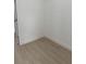 Neutral room with luxury vinyl plank flooring and white trim at 2942 Sw 162Nd St, Ocala, FL 34473