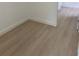 Neutral room with wood-look floors and white trim at 2942 Sw 162Nd St, Ocala, FL 34473