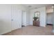 Light and airy hallway featuring neutral carpet and a decorative mirror at 2993 Moulin Rd, Davenport, FL 33837