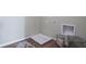 Simple laundry area with utility hookups and wooden-look flooring at 2993 Moulin Rd, Davenport, FL 33837