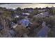 Aerial view of a charming home near the water, surrounded by lush trees and landscaping at 340 W 9Th Ave, Mount Dora, FL 32757