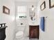 Classic powder room featuring wainscoting, pedestal sink, and charming vintage tile at 340 W 9Th Ave, Mount Dora, FL 32757