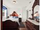 Bedroom with a bed, vanity with mirror, dresser, and hardwood floors at 340 W 9Th Ave, Mount Dora, FL 32757
