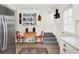 Cozy dining area features hardwood floors, rustic table, and a decorative display of blue and white porcelain plates at 340 W 9Th Ave, Mount Dora, FL 32757