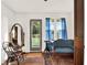 Charming entryway with hardwood floors, vintage furniture, and a view of the outdoors at 340 W 9Th Ave, Mount Dora, FL 32757