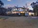 This two-story house has a large lawn and an outdoor pool at 340 W 9Th Ave, Mount Dora, FL 32757