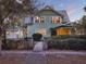 Charming two-story home with a metal roof and a well-manicured front yard at 340 W 9Th Ave, Mount Dora, FL 32757