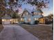 Spacious two-story home with an attached garage and a long driveway at 340 W 9Th Ave, Mount Dora, FL 32757