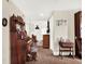 Hallway boasts antique decor, including an ornate organ and vintage furniture, creating a unique, nostalgic charm at 340 W 9Th Ave, Mount Dora, FL 32757