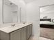 Bathroom features double sinks and view into bedroom at 350 Rustic Rail Dr, Lake Wales, FL 33859
