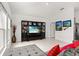 Living room features a large entertainment center and access to other rooms at 350 Rustic Rail Dr, Lake Wales, FL 33859