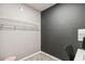 A walk-in closet with black and gray walls, wire shelving and carpeted floors at 3838 Marbella Way, Davenport, FL 33897