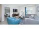 Comfortable living room with gray sofa, blue chair, and modern decor at 4001 Breakview Dr # D306, Orlando, FL 32819