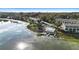 Aerial view of condo complex with a pool and boat docks on the lake at 402 E Orlando Ave # 18C, Ocoee, FL 34761