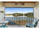 Relaxing balcony view with seating overlooking a scenic lake, perfect for enjoying the outdoors at 402 E Orlando Ave # 18C, Ocoee, FL 34761